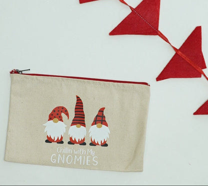 Beige pouch with cartoon gnomes and text on a white background for Christmas