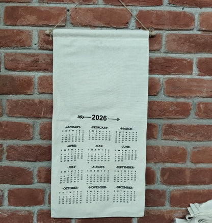 Calendar for 2026 hanging on a brick wall